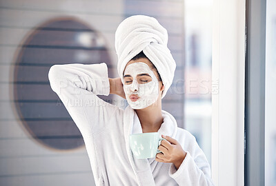 Buy stock photo Woman, facial and drinking coffee after morning shower, happy wellness and healthy skincare cosmetics in home bathroom. Funny, pout lips and young female, face mask and clean beauty cosmetology 