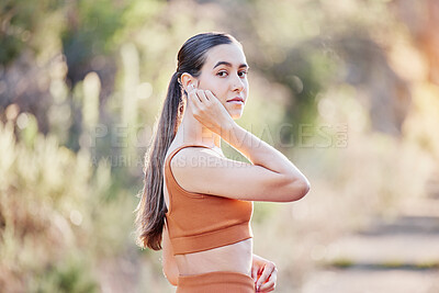 Buy stock photo Fitness portrait, earphones and woman in nature streaming podcast, radio or motivation music for running. Sports, healthcare and female from Canada listening to audio and getting ready for training.