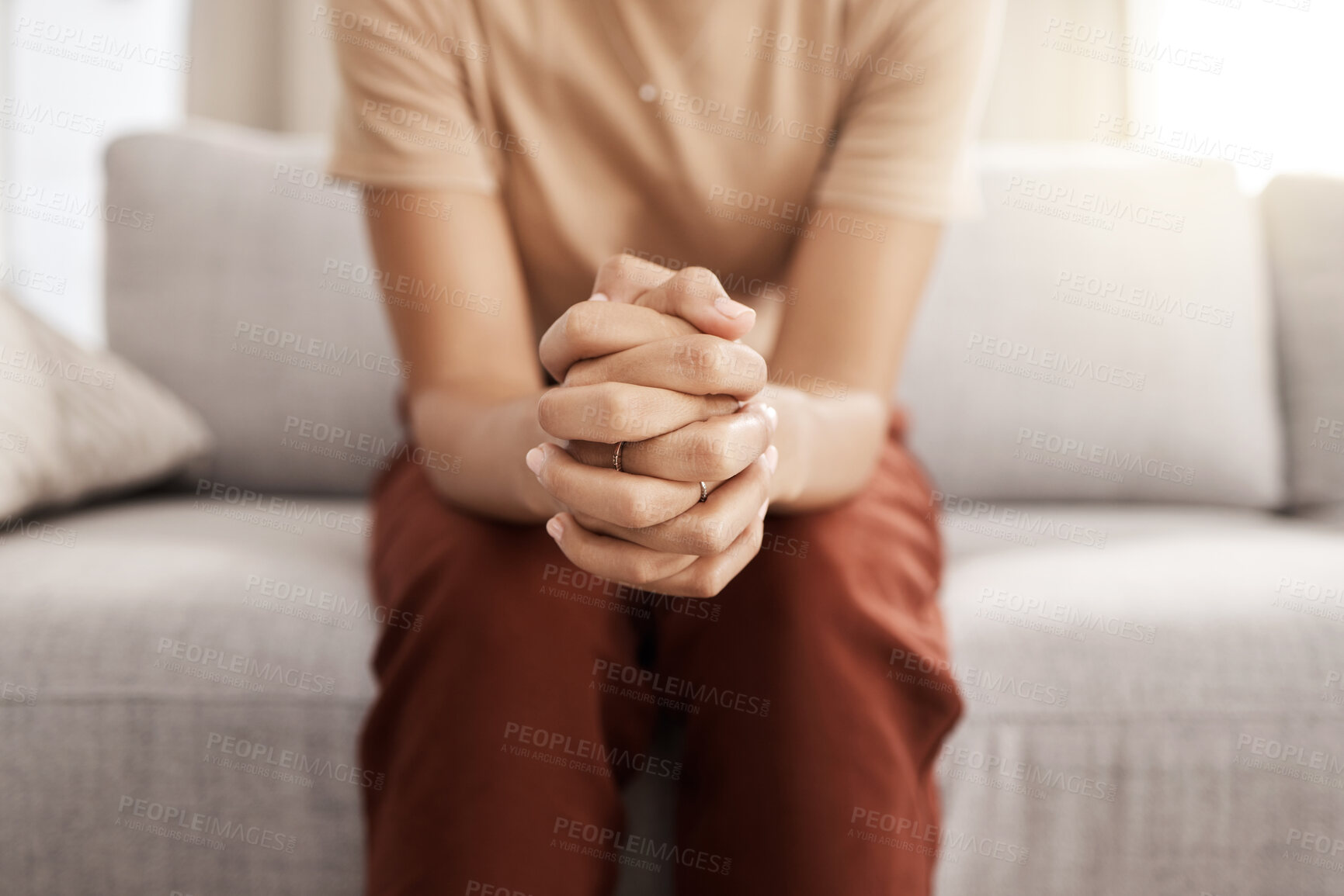 Buy stock photo Stress, worry and hands of woman on sofa with mental health issue, problem and anxiety at home. Depression, sadness and close up of connected hand of girl with fear, nervous and stressed expression