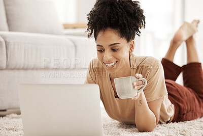 Buy stock photo Laptop, coffee and relax with a woman lying on the floor in her home living room over the weekend. Computer, social media and internet with a female typing or reading an email while in her house