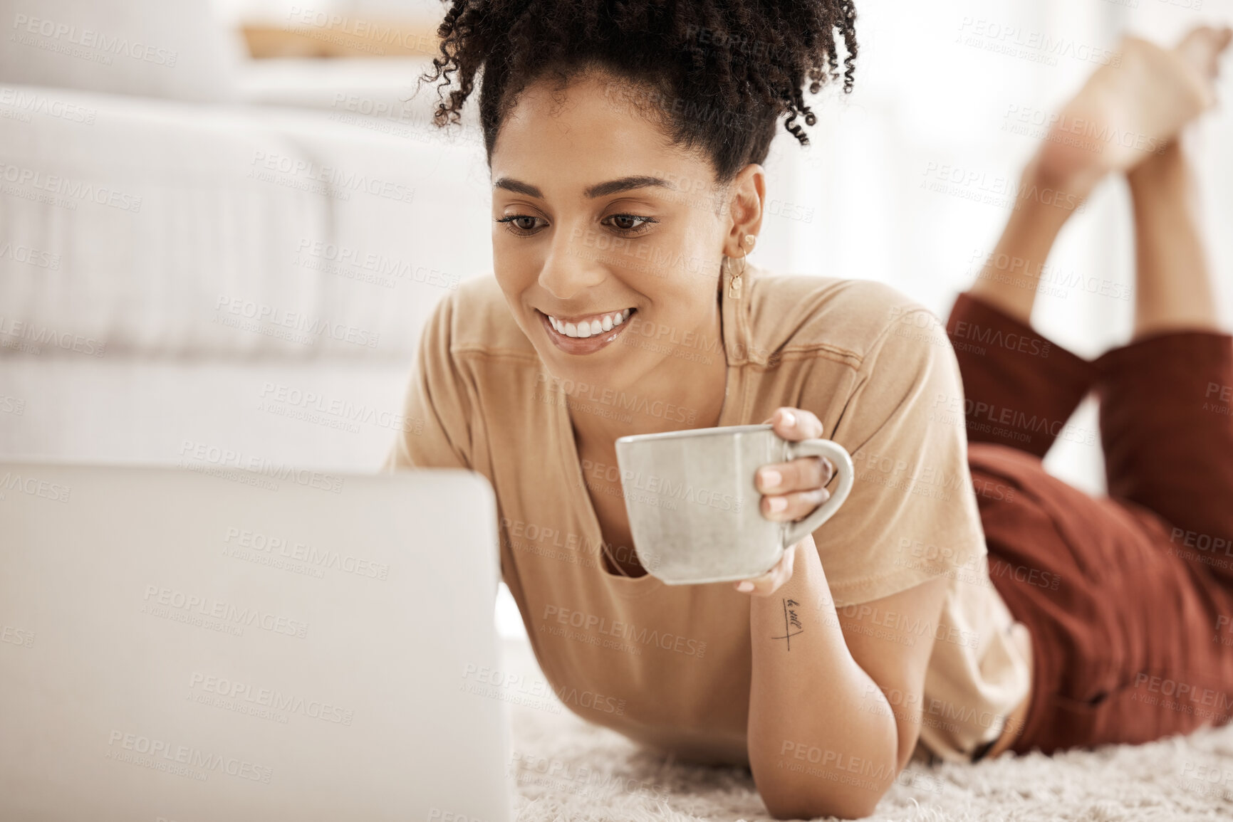 Buy stock photo Black woman, coffee and home computer of a person watching a video or writing a remote work email. Digital employee in the morning on a laptop online shopping or streaming series on a house carpet