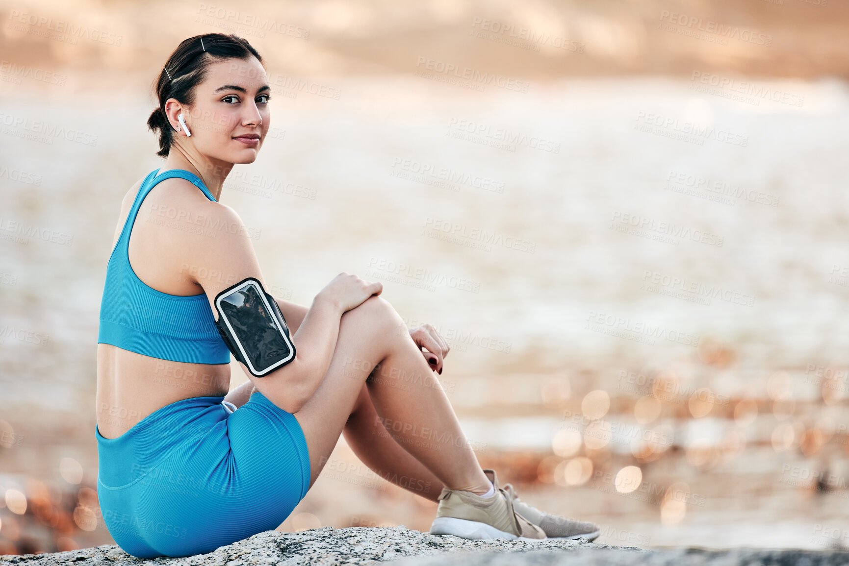 Buy stock photo Arm band, young woman and fitness outdoor, for workout and exercise for wellness and health. Portrait, female athlete and girl with equipment for training, relax and practice for calm and mockup.