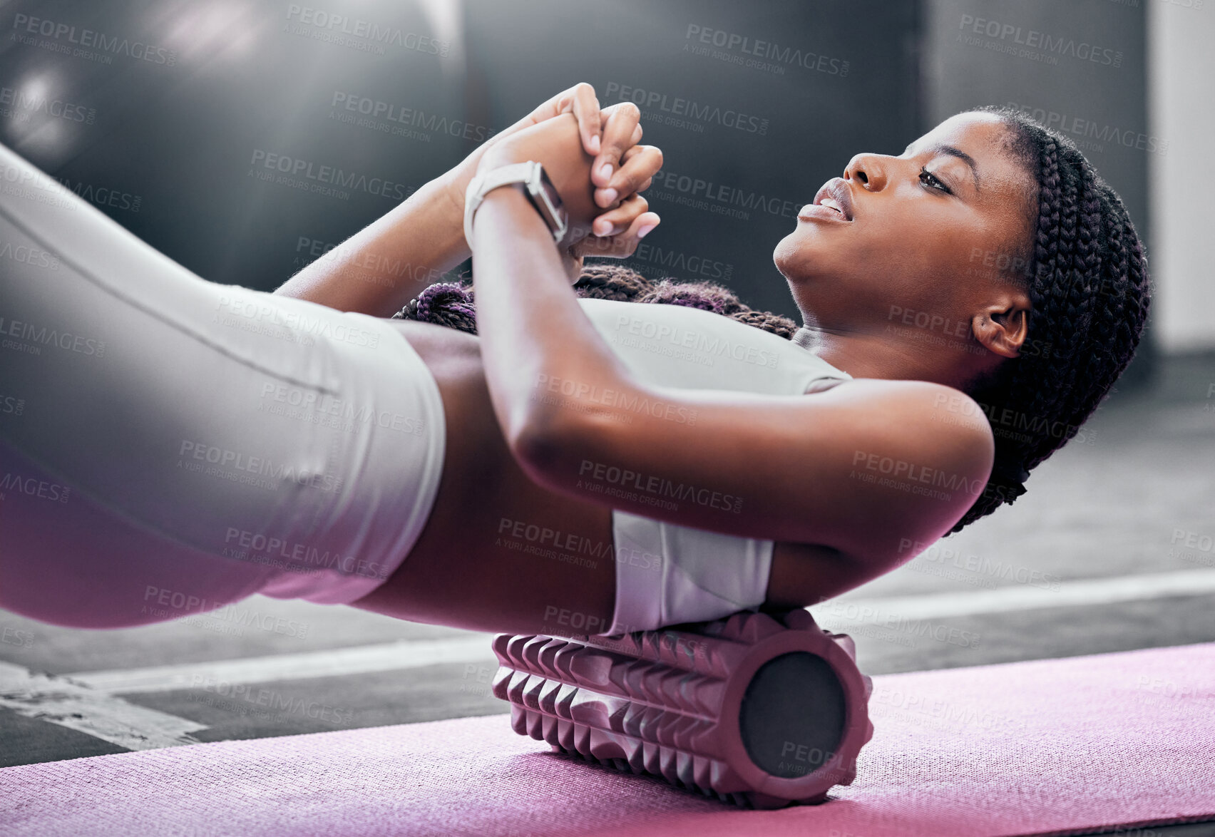 Buy stock photo Fitness, exercise and foam roller with a black woman in gym,  training during a workout for health. Yoga, wellness and pilates with a female athlete exercising in a sports club for physiotherapy