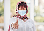 Thumbs up, Islamic woman and mask for covid protection, vaccine and health outdoor. Muslim female, hand gesture or healthy lady with face cover, corona and safety regulations for virus and infection.