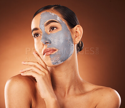 Buy stock photo Woman, clay face mask and beauty, facial makeup and detox dermatology on studio background. Female model, skincare product and charcoal cosmetics for shine, natural glow and aesthetic transformation