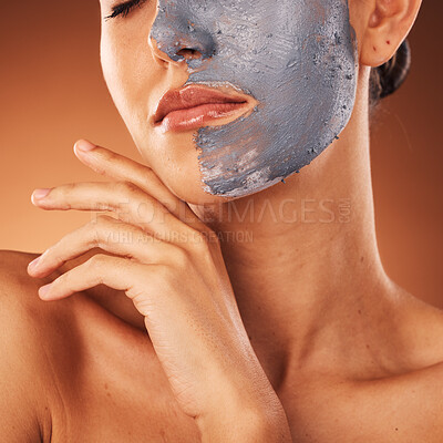Buy stock photo Woman, face mask or skincare mud facial on orange studio background in self care, dermatology or acne treatment. Zoom, beauty model or cream product for cleaning, healthcare glow or collagen wellness
