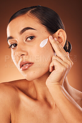 Buy stock photo Portrait, face and woman with sunscreen for skincare, dermatology or self care grooming routine in studio. Beauty, young girl or healthy model moisturizing with a natural luxury facial cream product