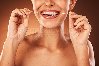 Buy stock photo Teeth, zoom and woman with floss for dental cleaning, teeth whitening and healthy mouth protection in studio. Smile, wellness or hands of girl flossing with thread for natural tooth shine, self care