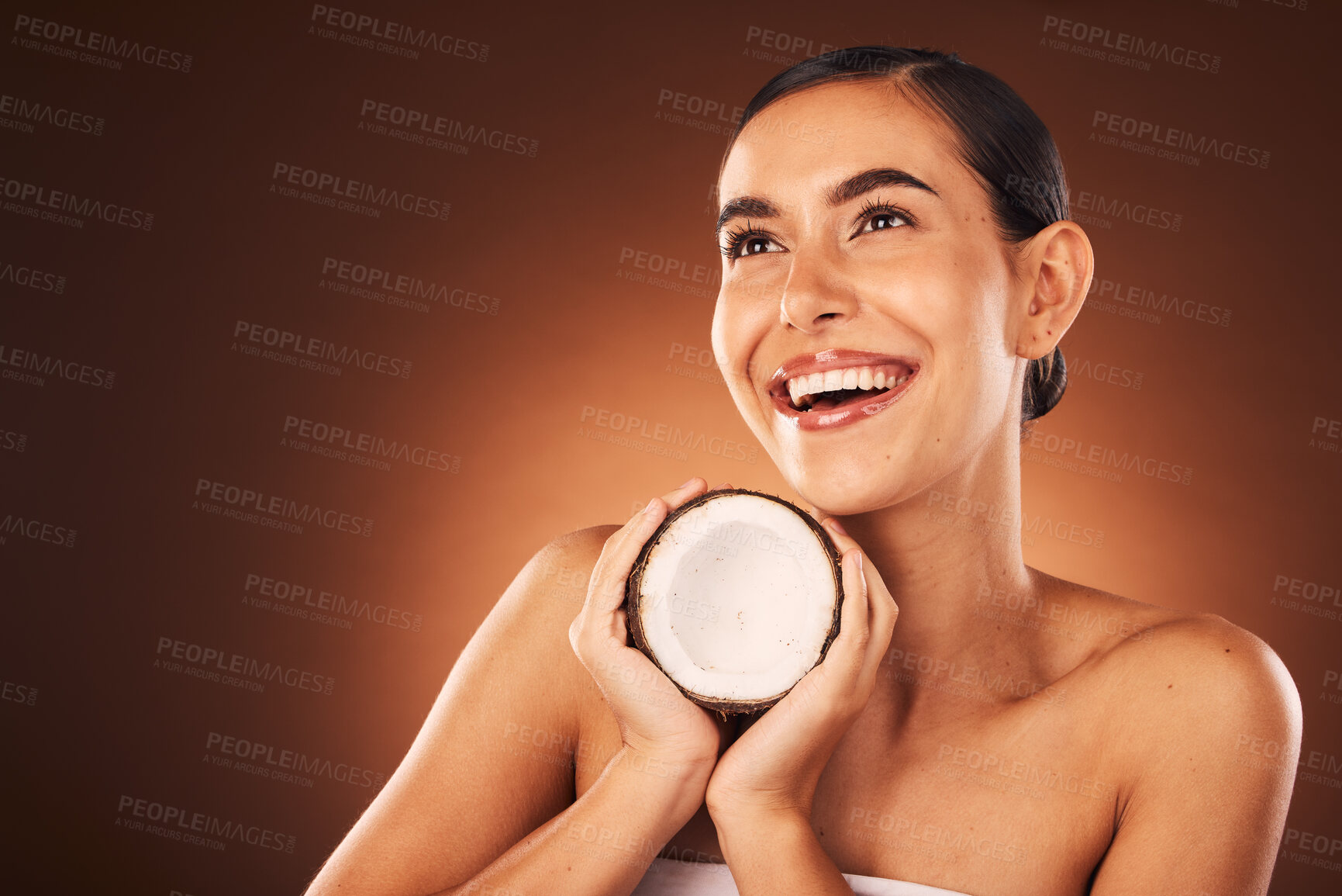 Buy stock photo Coconut, skincare and beauty woman in studio for natural product advertising or marketing mockup. Idea, thinking or excited face model with fruit dermatology, cosmetics or nutrition benefit promotion