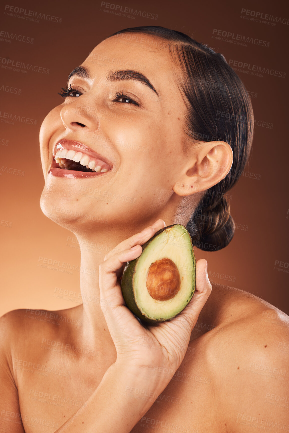 Buy stock photo Beauty, woman skincare and healthy avocado eating for body wellness. health and nutrition. Happy model with skin glow from diet, vitamin a and fiber food smile about natural dermatology ingredient