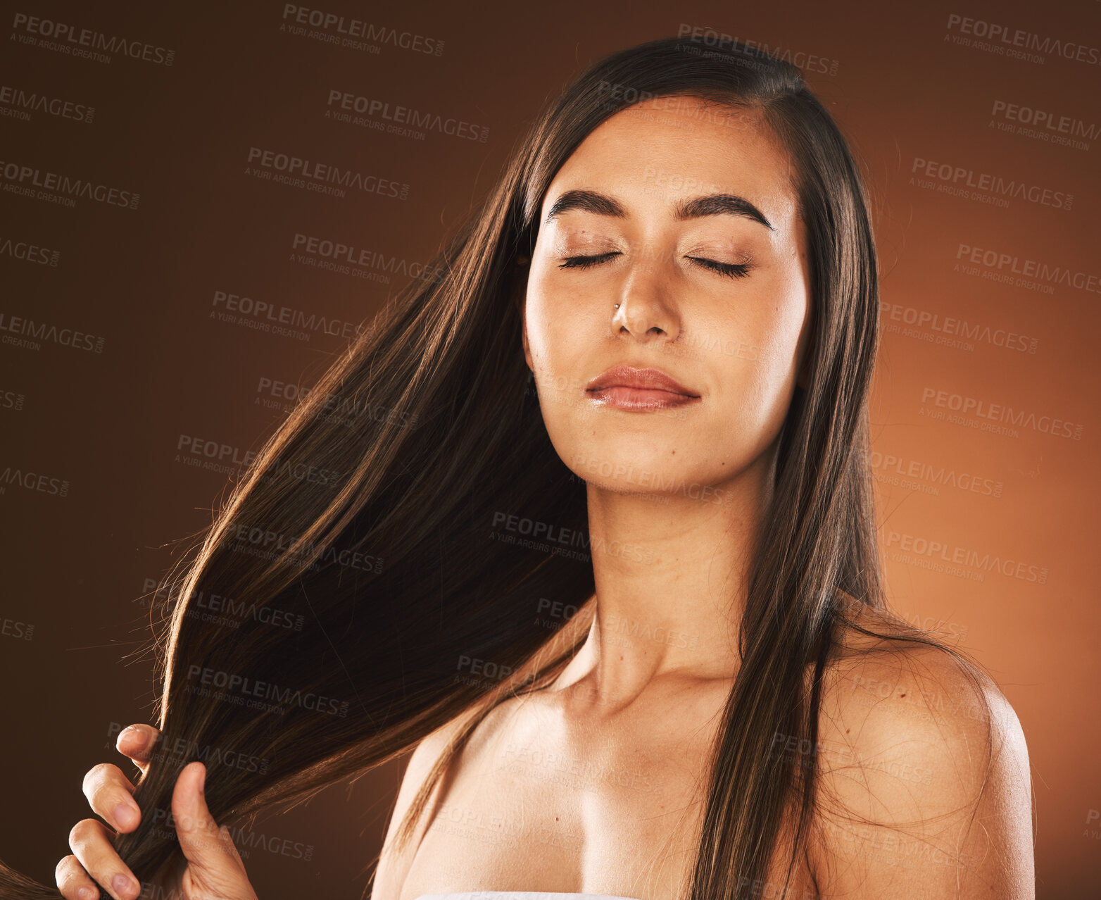 Buy stock photo Face, beauty and hair care of woman with eyes closed in studio isolated on a brown background. Skincare, makeup and cosmetics of healthy female model from Canada satisfied with salon hair treatment.