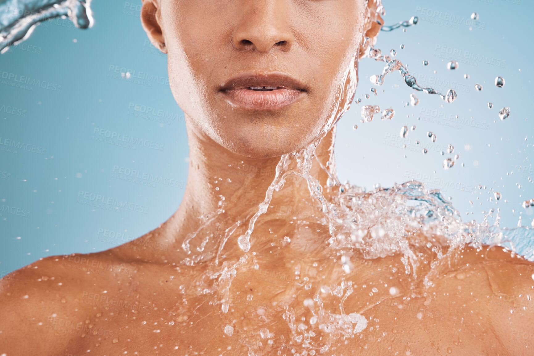 Buy stock photo Water, cleaning and shower with a model black woman in studio on a blue background for hydration or hygiene. Relax, wellness and luxury with a water splash on a female in the bathroom for skincare
