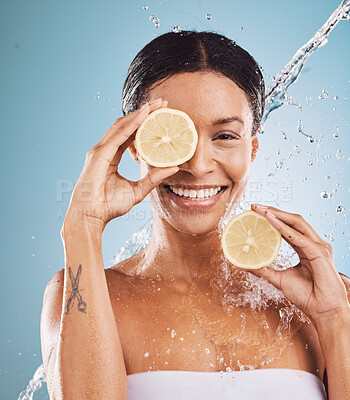 Buy stock photo Lemon, portrait and skincare black woman in studio water splash for cosmetics, makeup or facial cleaning product. Skin care, vitamin c and healthy model face with fruit for dermatology on blue mockup