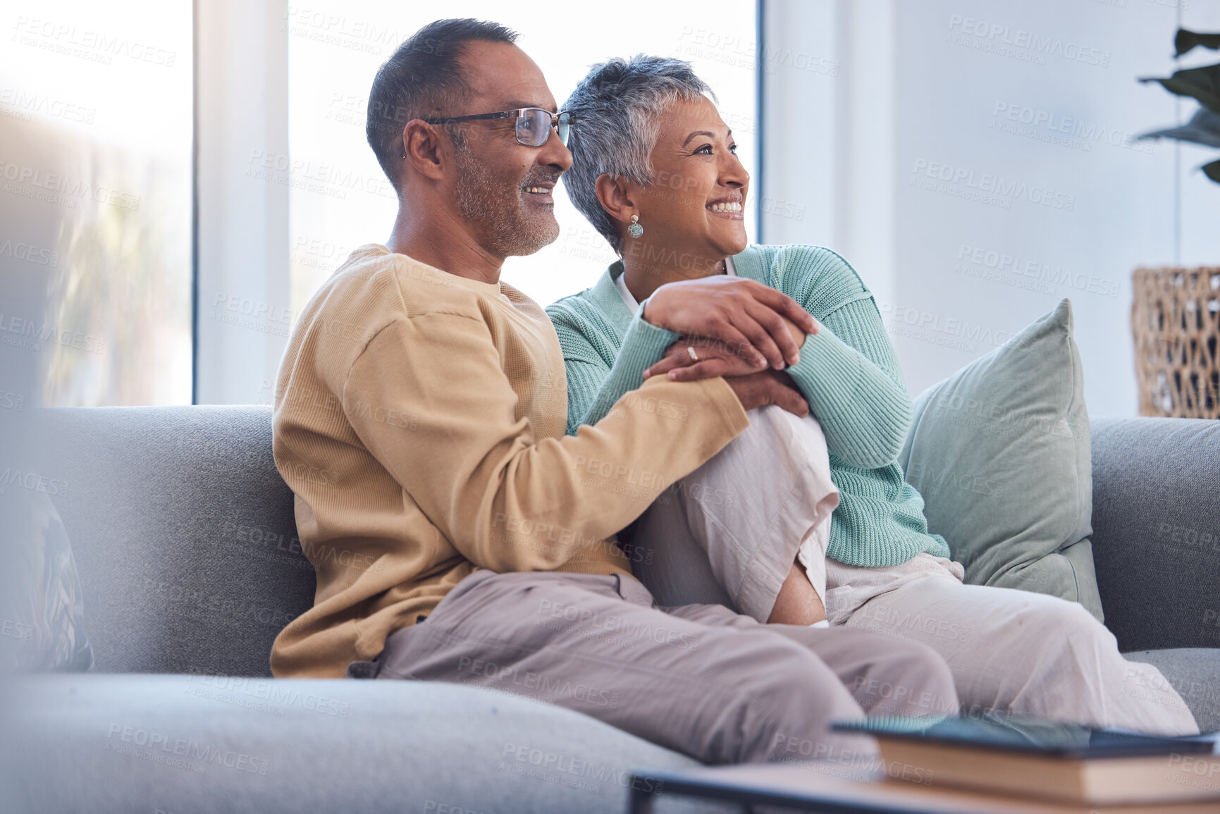 Buy stock photo Elderly couple, relax and smile watching tv, movie or streaming on sofa together at home. Senior man and woman relaxing on living room couch enjoying online shows, media or entertainment indoors