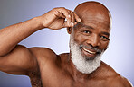 Tweezer, man and beauty portrait of senior male remove eyebrow hair on a grey studio background. Face, african American male and haircare with tweeze epilation or hair removal on a studio backdrop