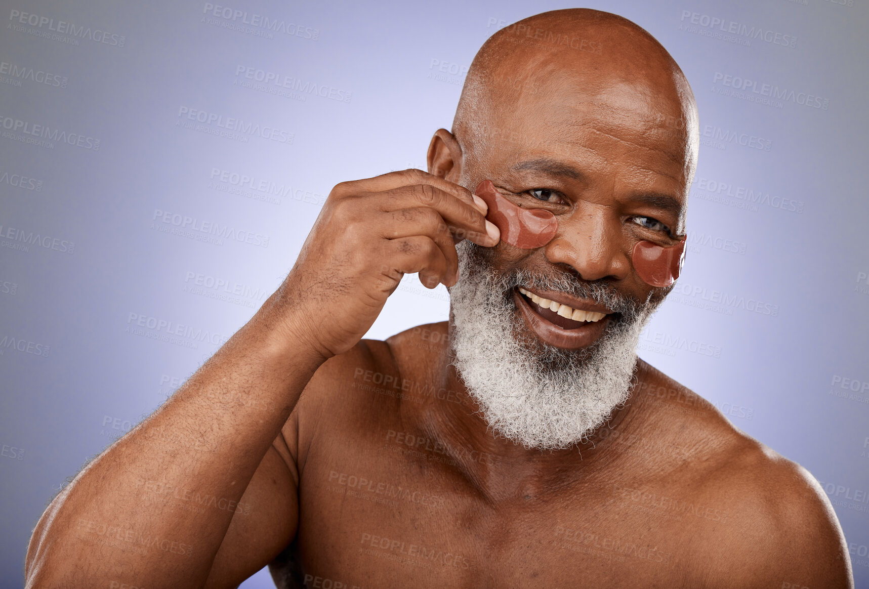 Buy stock photo Face, senior and black man with eye patches in studio on a purple background. Portrait, skincare and retired elderly male model from Nigeria with anti aging product, facial pads or mask for wellness.