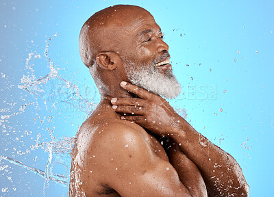 Buy stock photo Beauty, skincare and splash with black man and water for shower, hydration and hygiene. Cleaning, fresh and grooming routine with senior model for self care, cosmetics and luxury in blue background