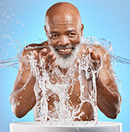 Black man, skincare and senior water splash in mockup of  bathroom sink, clean skin health and natural hygiene wellness. Healthy elderly model, happy face with smile and advertising facial healthcare