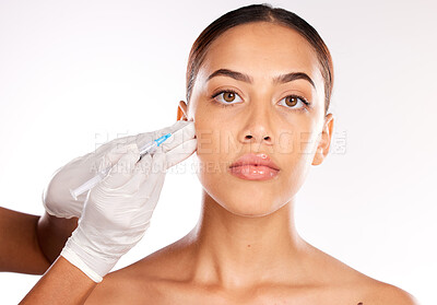 Buy stock photo Botox, face and injection of woman and plastic surgery hands in studio for medical facial, beauty and aesthetic dermatology. Mesotherapy, hyaluronic acid or collagen help, trust and model in portrait