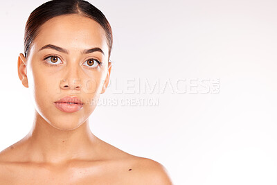 Buy stock photo Skincare, beauty and portrait of Latin woman on a white background studio for dermatology, body care and heath. Wellness, spa and face of girl with facial treatment, skincare products and cosmetics