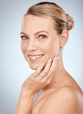 Buy stock photo Beauty, skincare and woman with hand on face for natural cosmetics, healthy skin and cosmetic dermatology. Portrait of happy wellness model, organic facial glow and smile on a gray studio background
