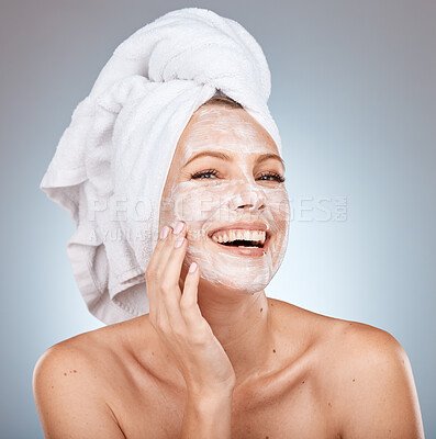 Buy stock photo Skincare, facial cream and woman with mask on gray background studio for wellness, beauty and spa. Dermatology, cosmetics and happy girl with moisturizer, facial mask and skincare products for face