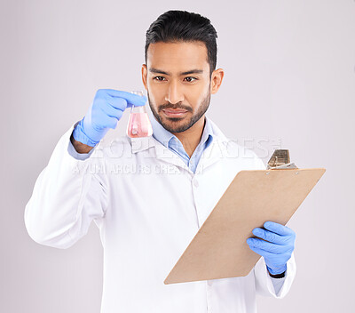 Buy stock photo Young scientist man, beaker and checklist with thinking, analysis and notes in studio by white background. Asian science expert, clipboard and paperwork for chemistry, ideas and study at pharma job