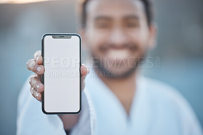 Buy stock photo Sports, fitness mockup or happy man with phone for karate tips, fighting info or martial arts promo code. Portrait blur, screen or mma fighter with mobile app in healthy workout, exercise or training