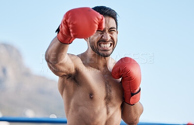 Buy stock photo face, man or angry boxer punching in training, exercise or workout with strong boxing power outdoors. Serious fighter, fitness or Asian combat sports athlete fighting in mma practice match with pain