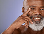 Aesthetic, senior and black man skincare portrait with smile for wellness, health and dermatology zoom. Mature, happy and african cosmetic model touching face on purple studio marketing mockup.