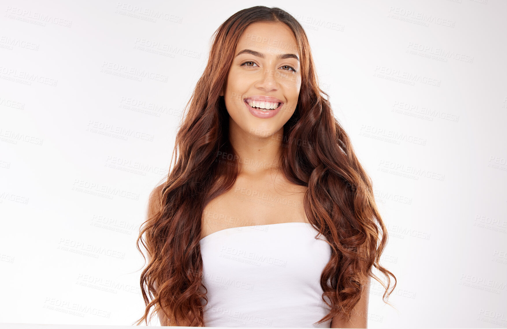 Buy stock photo Beauty, hair care and portrait of a happy woman in studio for a keratin, brazilian or botox treatment. Hair, wellness and girl model with long, shiny and curly hair style isolated by white background