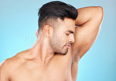 Buy stock photo Smell, hygiene and sweat with armpit of man for product, deodorant and cologne fragrance. Perfume, cosmetics and shower with model for antiperspirant, routine and underarm care in blue background 
