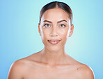 Beauty, face and skin with woman in makeup portrait, skincare, facial and treatment for wellness with blue studio background. Natural cosmetics, clean look cosmetic and glow with dermatology mockup.