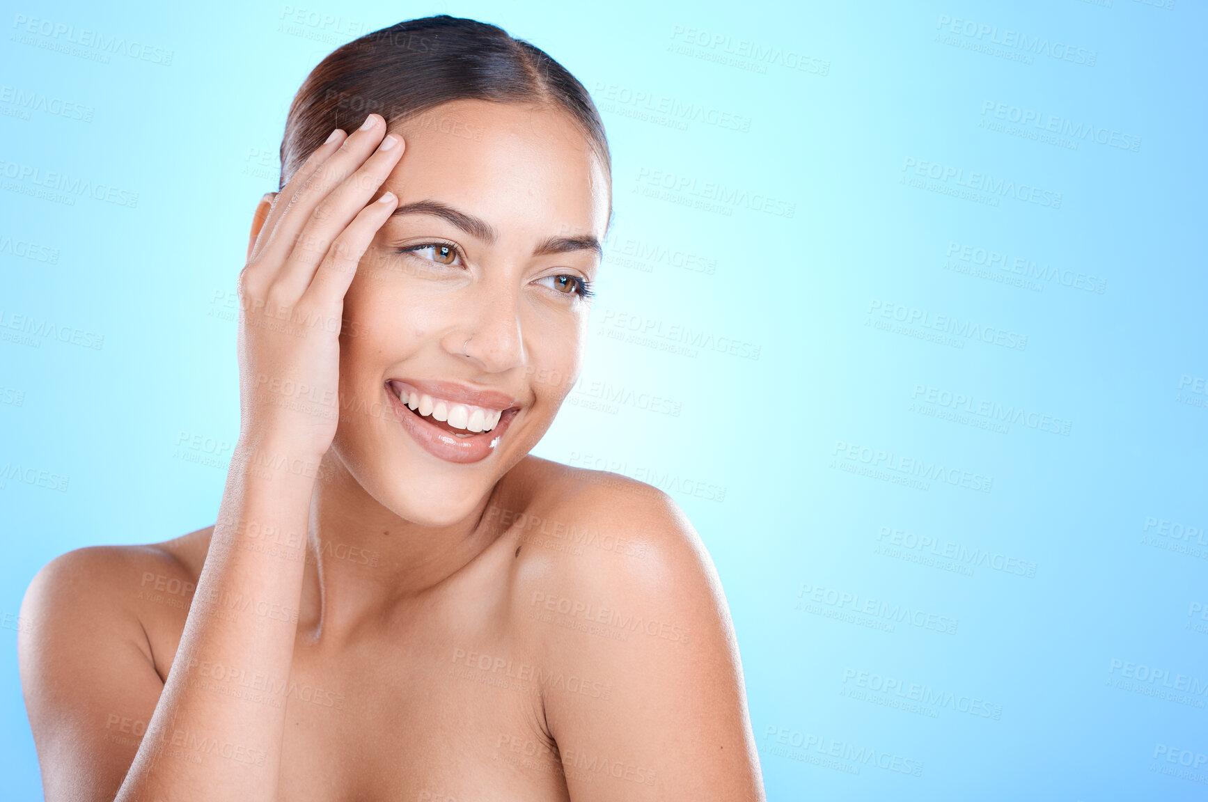 Buy stock photo Beauty, face and woman happy with skincare, cosmetics and makeup on a blue studio background. Aesthetic, cosmetology and dermatology with a beautiful female with skin care, body care wellness 