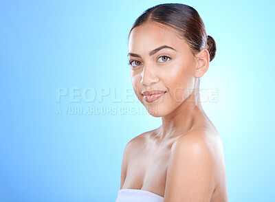 Buy stock photo Portrait, skincare and mockup with a model black woman in studio on a blue background for advertising. Face, skin and cosmetics with an attractive young female posing to promote natural treatment