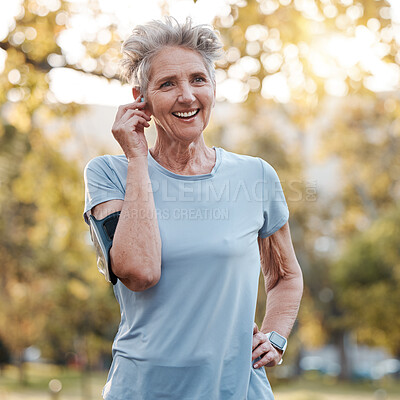 Buy stock photo Senior woman, run outdoor and happy with music or audio podcast for lifestyle motivation, runner fitness and exercise workout. Elderly athlete, smile and training or running rest in nature park 