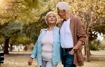 Buy stock photo Senior couple, bonding or walking in nature park, city garden or public environment in relax exercise, mobility or retirement break. Smile, happy woman or talking elderly man in hug and weekend date