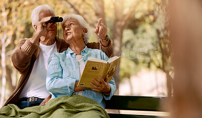 Buy stock photo Happy senior couple bird watching in park for relax bonding time together, freedom and retirement peace on outdoor bench. Elderly marriage love, binoculars and book reading woman with man pointing