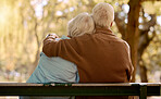 Relax, hug and love with old couple in park for happiness, marriage and calm. Peace, nature and retirement with man embracing woman on bench for affectionate, bonding and wellness date together