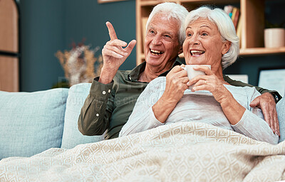 Buy stock photo Couple in retirement, elderly and watch television on couch at family home, relax with funny tv show or movie and excited with happiness and coffee. Retired, old man and old woman happy together.