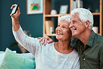 Couple, elderly and selfie with smile and retirement, woman holding smartphone for picture with man and happy at home. Bond, commitment and marriage, senior people happiness in photograph with phone.