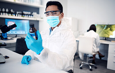 Buy stock photo Covid, scientist and man with bottle in laboratory with cure or cough mixture. Science, research and male developing chemical, medicine or treatment, remedy or medication for flu, corona or covid 19.