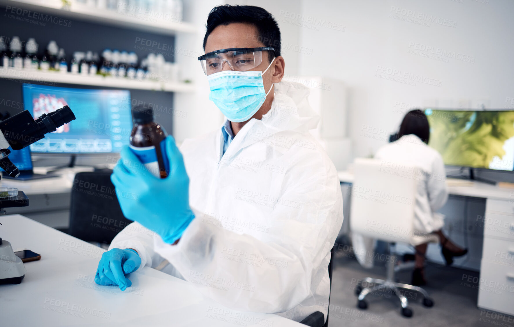 Buy stock photo Covid, scientist and man with bottle in laboratory with cure or cough mixture. Science, research and male developing chemical, medicine or treatment, remedy or medication for flu, corona or covid 19.