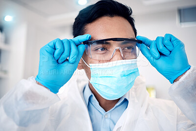 Buy stock photo Covid, science and goggles with a man at work on research or innovation in a laboratory as a scientist. Doctor, futuristic and face with a male working in development of a corona virus treatment