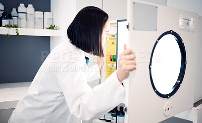 Buy stock photo Science, woman and scientist in laboratory with incubator, check for experiment, research and scientific innovation. Professional, phd doctor and chemistry, physics or biotechnology study in lab.