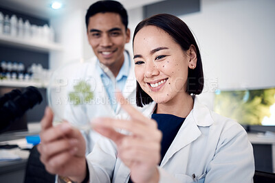 Buy stock photo Scientist team, smile and green plant for food science study with doctors happy about growth development, analysis and research. Man and woman together in laboratory for medical or ecology innovation