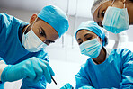 Surgery, team and hospital with surgeon support from medical staff in an operating room. Operation, collaboration and healthcare or doctor teamwork in emergency procedure while wearing scrubs