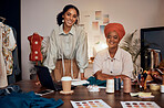 Portrait, black women and fashion workplace, laptop and prepare for runway show, complete order and talking for business growth. African American females, ladies or entrepreneurs with startup company