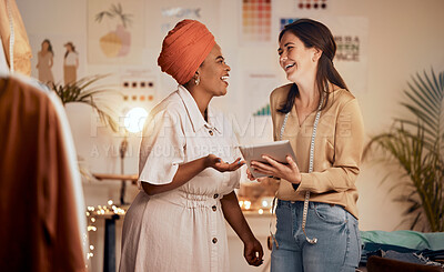 Buy stock photo Designer woman, partner and fashion with tablet, laughing and joke while planning, clothes and web app. Teamwork, black woman and design team for comic, funny moment and social media in night at job