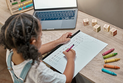 Buy stock photo Child, laptop and math homework while writing in a notebook for online learning at home. Elearning, digital education and mathematics lesson with distance education for little girl using the internet